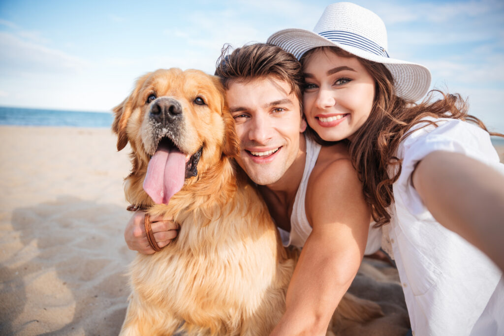 Couple with Dog on Beach