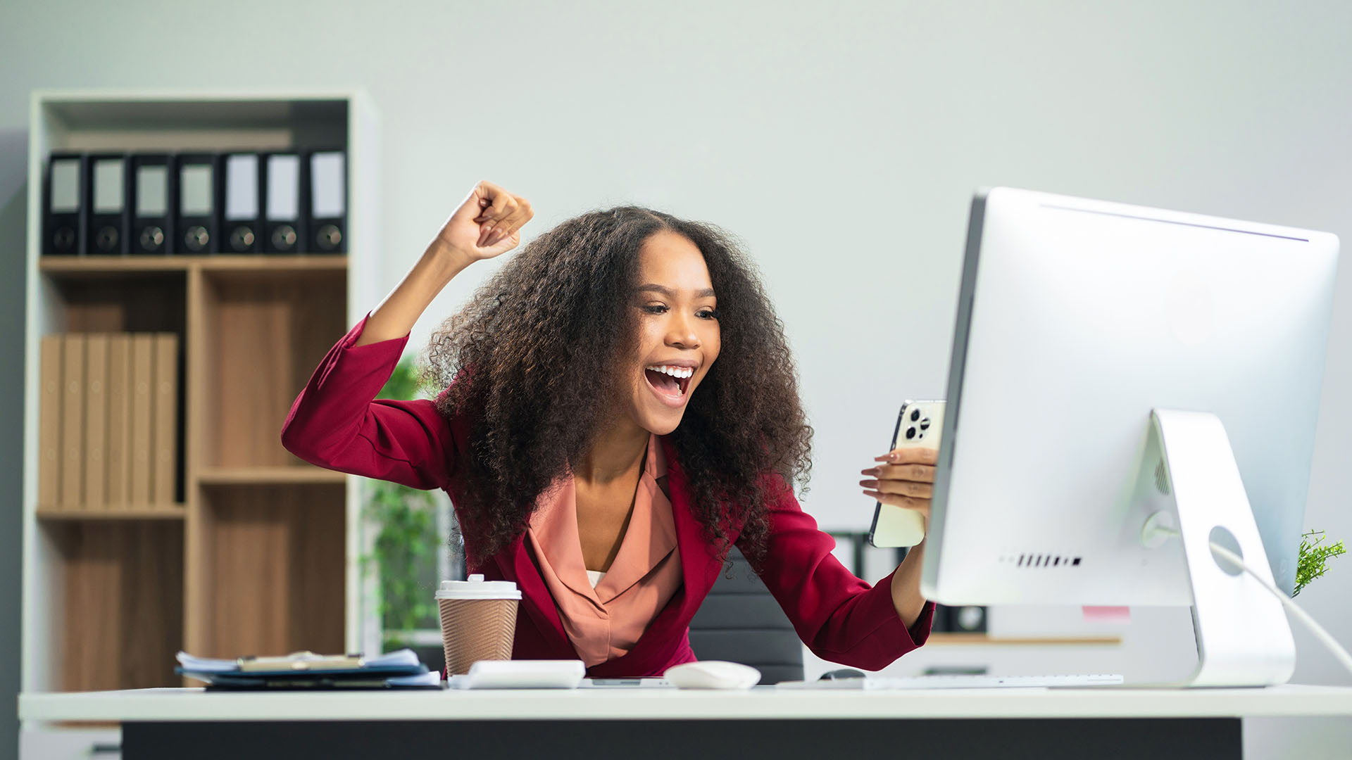 Excited Woman at Computer